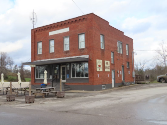 Façade and southeast elevation of the commercial building, looking north.