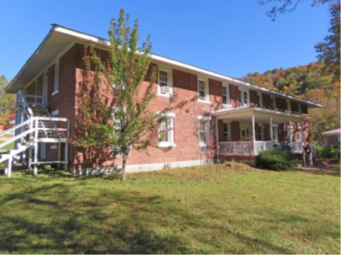 Northwest elevation and facade of the Girls’ Dormitory looking east.